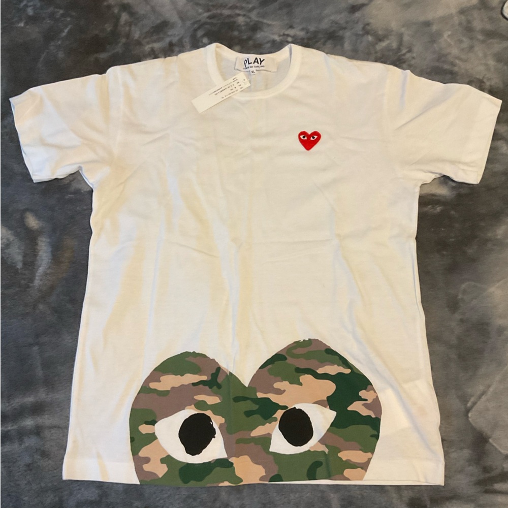 White PLAY shirt with little red heart near chest area